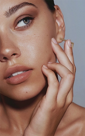 Beautiful woman's face with plump skin