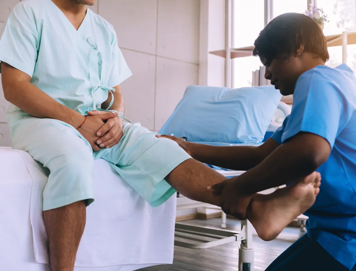 doctor examining mans leg