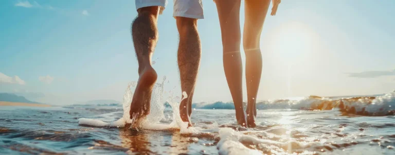 happy couple walking in ocean