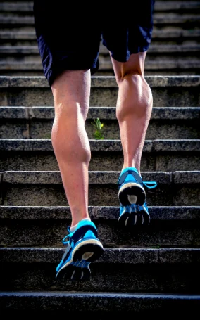 man walking up stairs